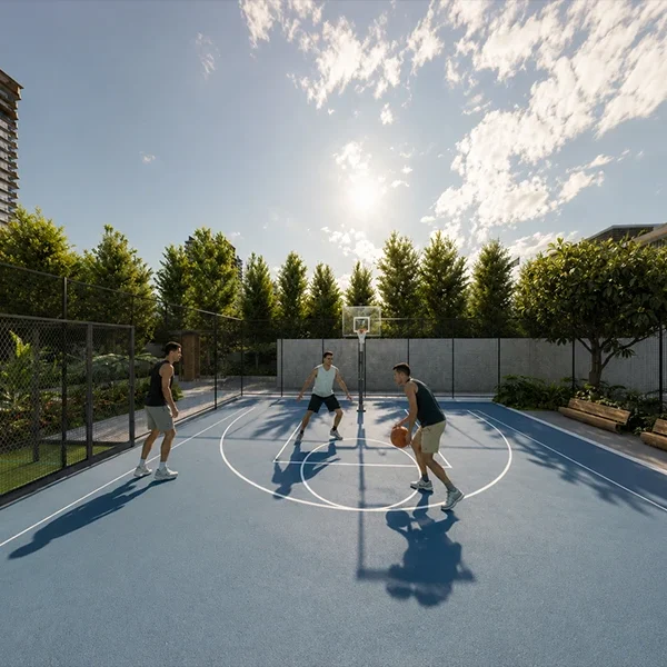 Outdoor basketball court at Highland Mayfields surrounded by landscaped green spaces.