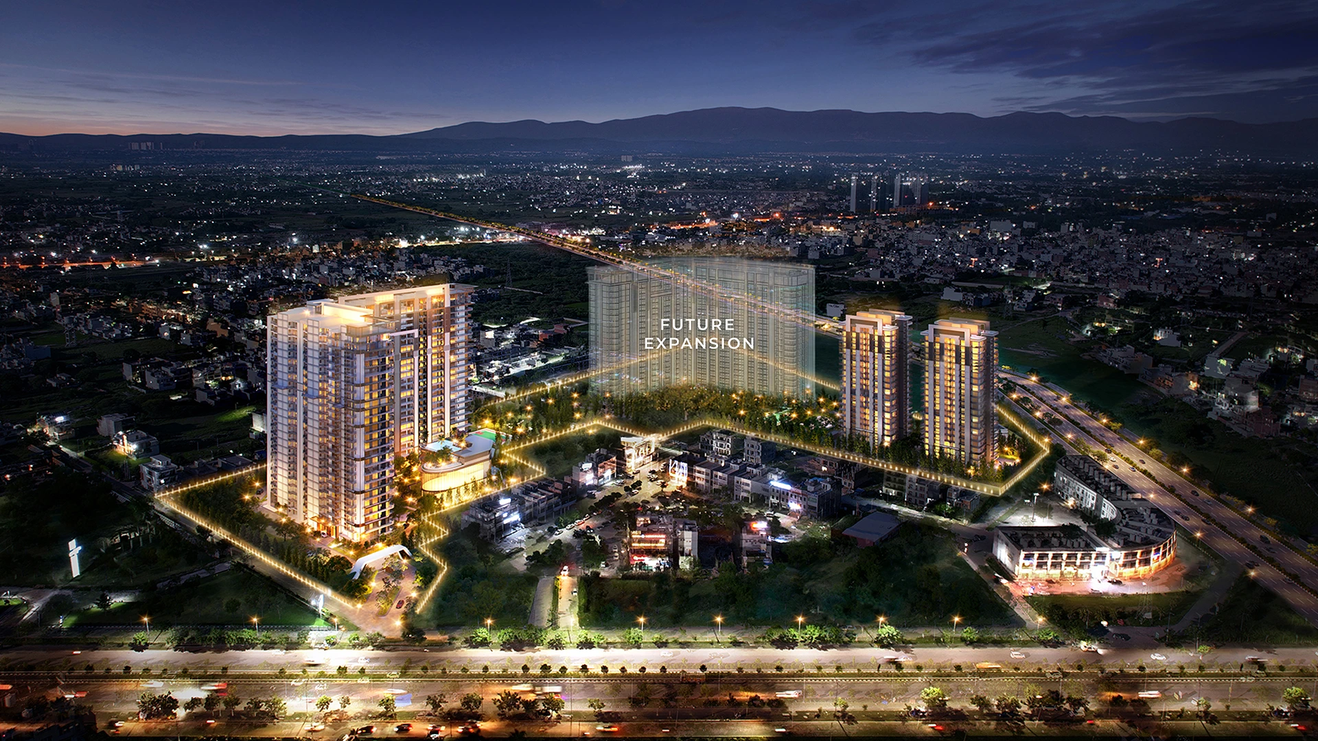 Night view of the Highland Mayfields luxury residential project showcasing illuminated buildings and landscaped surroundings.