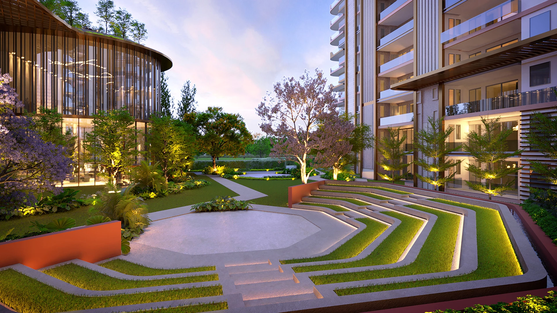 Outdoor amphitheatre at Highland Mayfields Sector 118 featuring landscaped seating, modern architecture, and open-air community spaces.